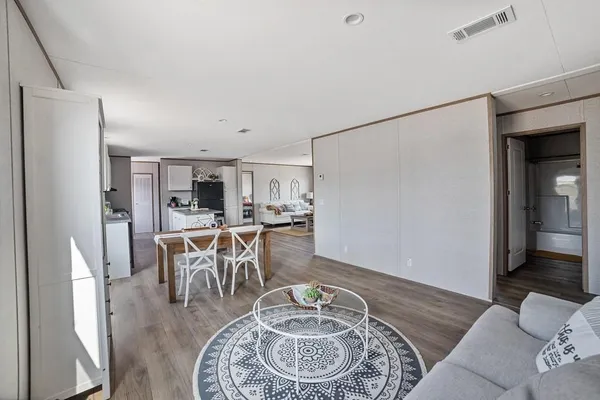 a living room with furniture and a table