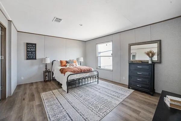 a bed room with a bed and a window