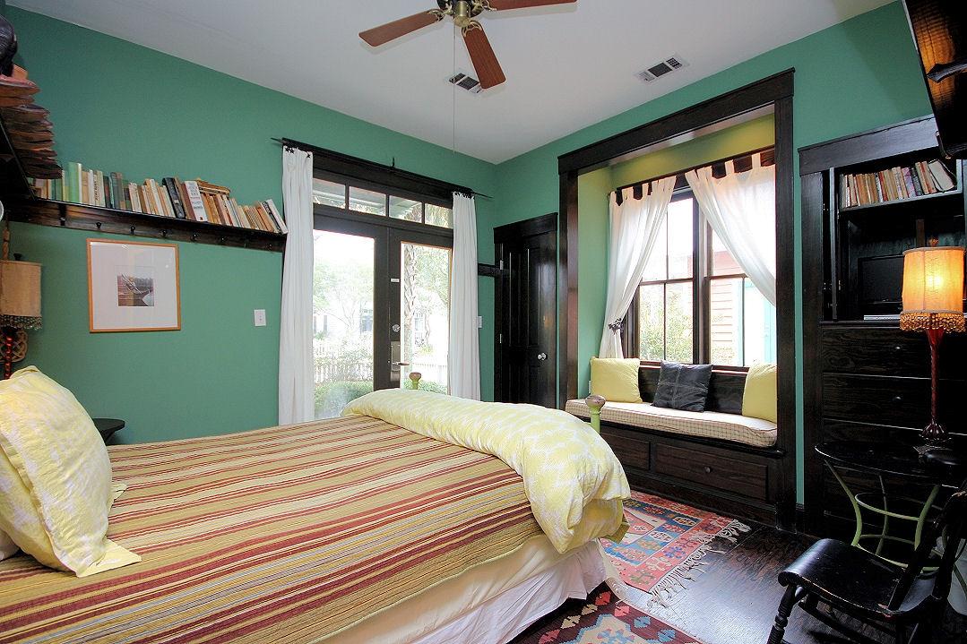 147 Grayton Street Santa Rosa Beach, FL 32459 - Photo 26 of 52 a bedroom with a bed a flat screen tv and a window