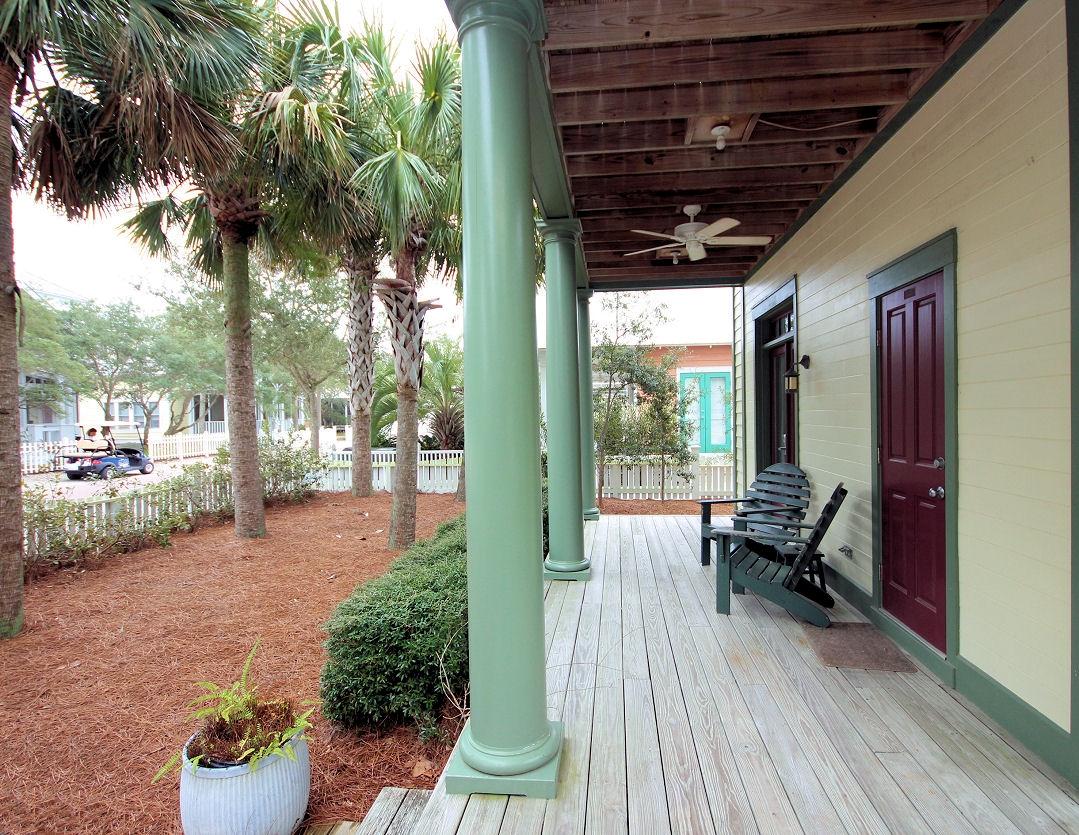 147 Grayton Street Santa Rosa Beach, FL 32459 - Photo 28 of 52 a view of a porch with furniture and a yard