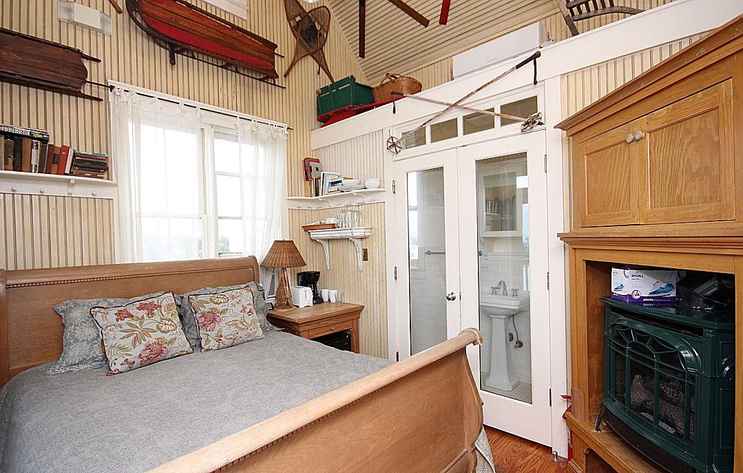 147 Grayton Street Santa Rosa Beach, FL 32459 - Photo 37 of 52 a living room with furniture a fireplace and a window