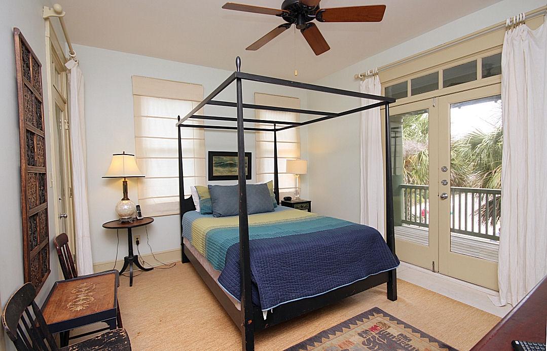 147 Grayton Street Santa Rosa Beach, FL 32459 - Photo 44 of 52 a bedroom with a bed wooden floor and window