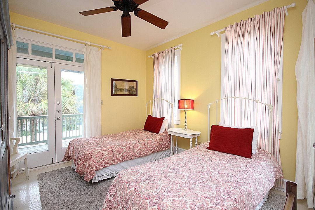 147 Grayton Street Santa Rosa Beach, FL 32459 - Photo 45 of 52 a bedroom with two beds and a large window with balcony view