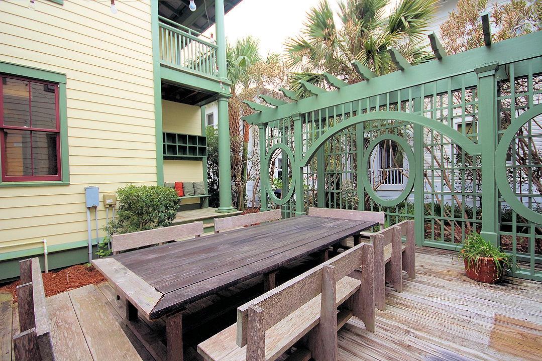 147 Grayton Street Santa Rosa Beach, FL 32459 - Photo 7 of 52 a view of a wooden deck with a table and chairs