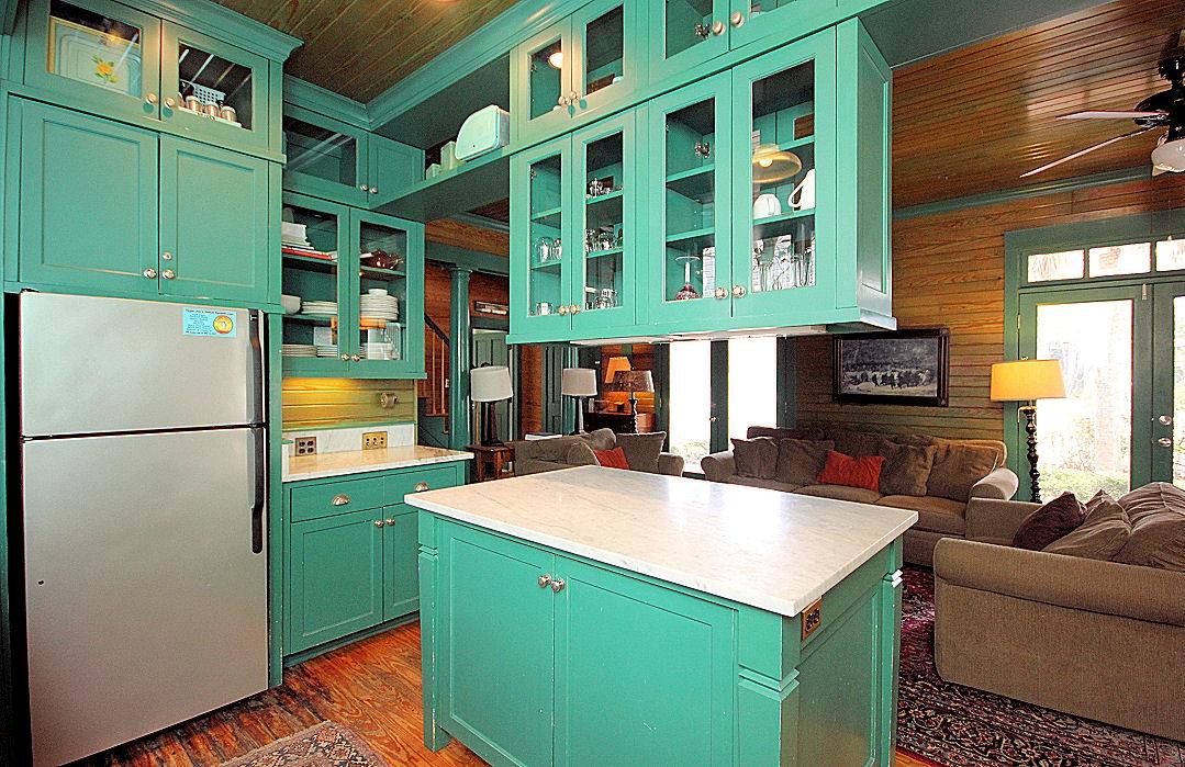 147 Grayton Street Santa Rosa Beach, FL 32459 - Photo 10 of 52 a view of a kitchen with a fridge and a stove top oven