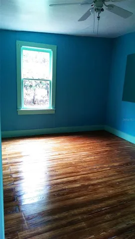 a kitchen with a stove a sink and a microwave