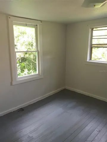 an empty room with windows