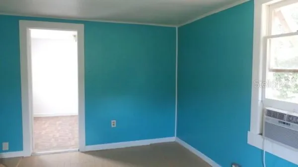 a kitchen with a sink and a refrigerator