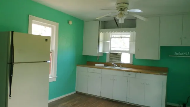 a backyard of a house with lots of green space