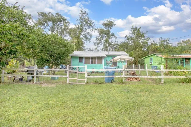 a view of house with outdoor space