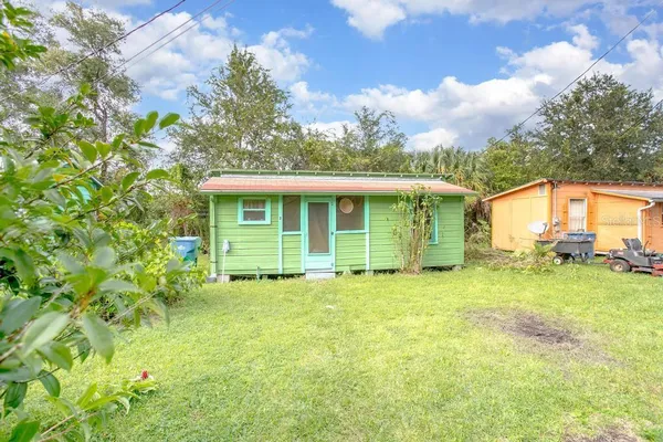a view of a house with a back yard