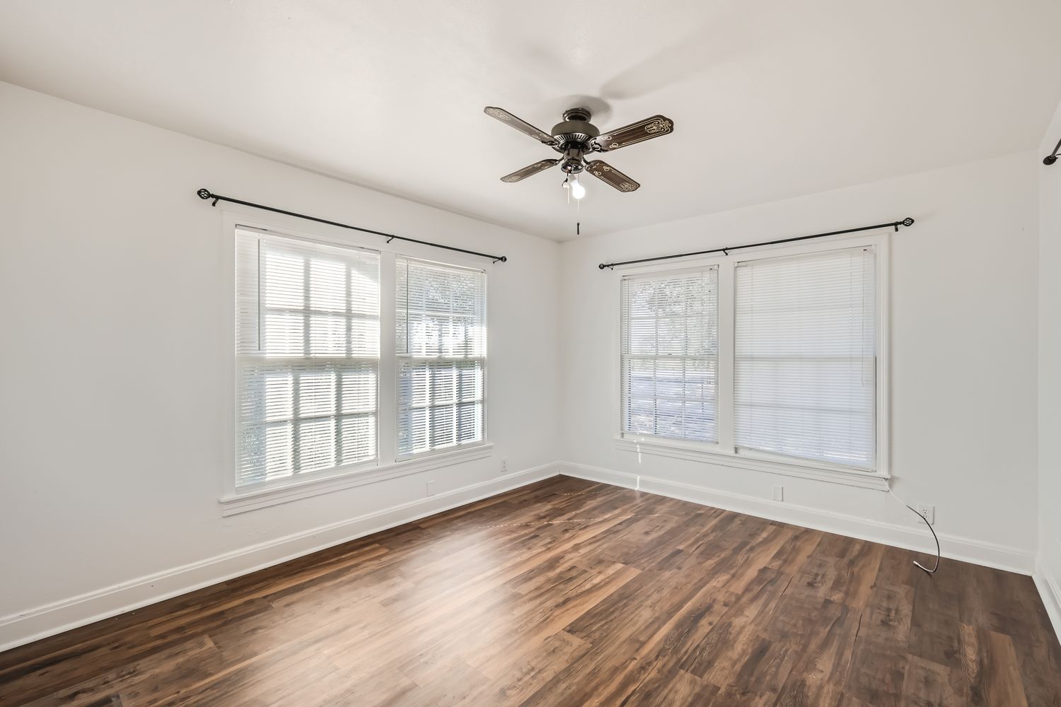 7348 Highway 183 Lockhart, TX 78644 - Photo 7 of 13 Unfurnished room featuring ceiling fan and dark wood-style floors