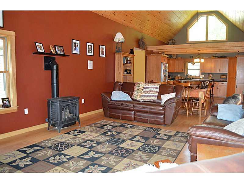 8 Beech Ridge Lane Otis, ME 04605 - Photo 32 of 34 Living Room. Propane heat stove