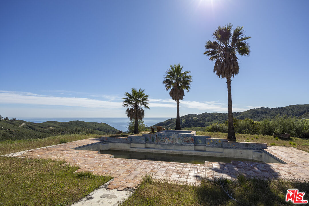 3030 Encinal Canyon Road Malibu, CA 90265 - Photo 11 of 12 a swimming pool with a yard