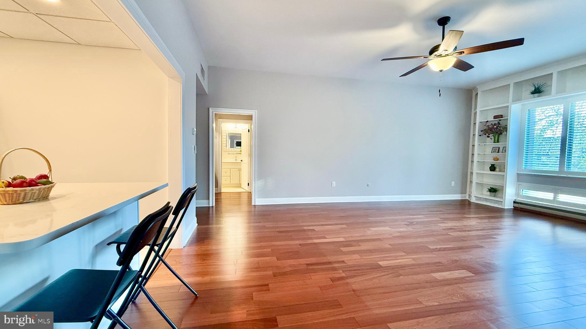 1 Markham Road, Unit 2E Princeton, NJ 08540 - Photo 16 of 30 a view of an empty room with wooden floor and a window