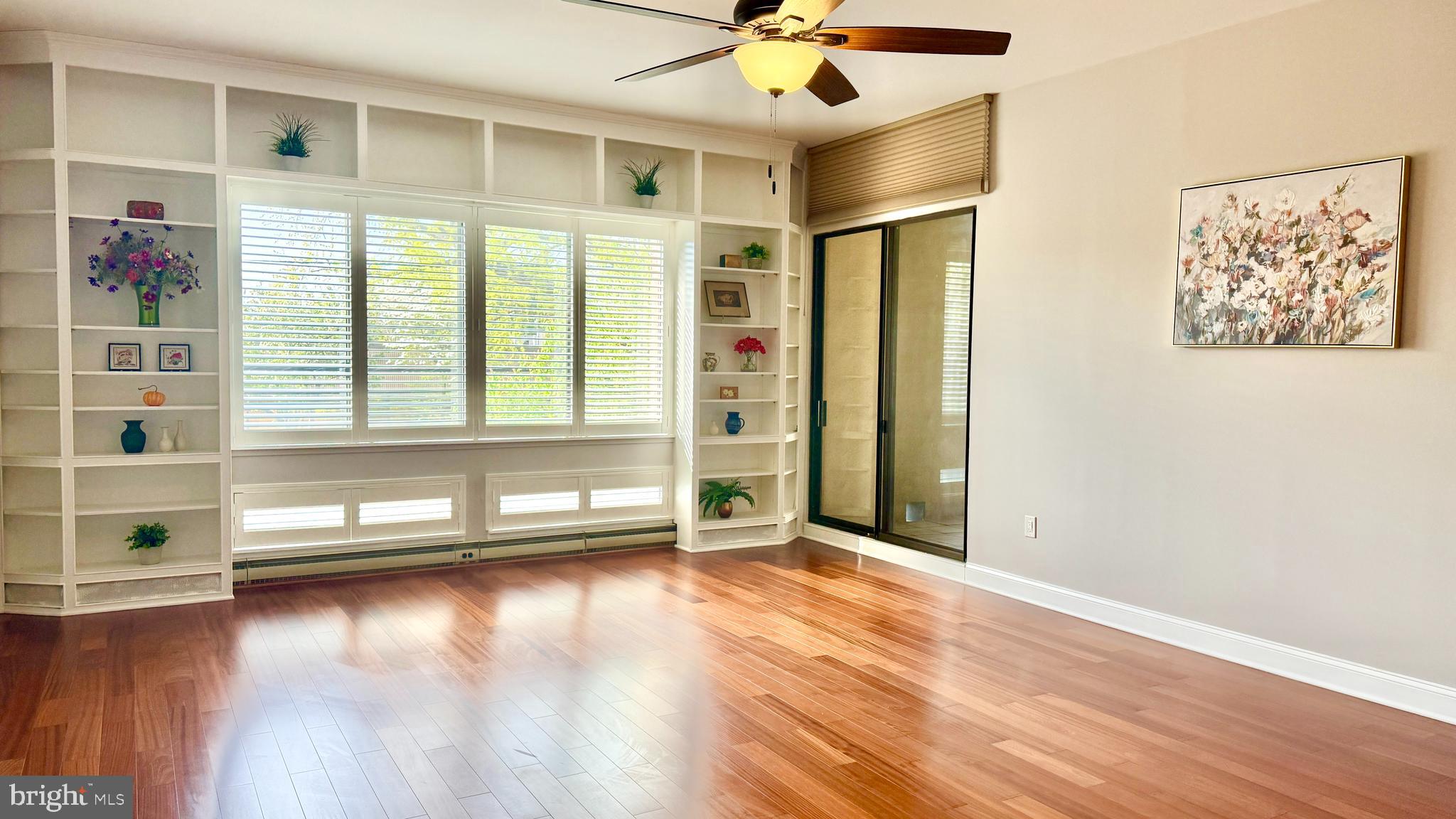 1 Markham Road, Unit 2E Princeton, NJ 08540 - Photo 17 of 30 a view of a livingroom with wooden floor and a ceiling fan