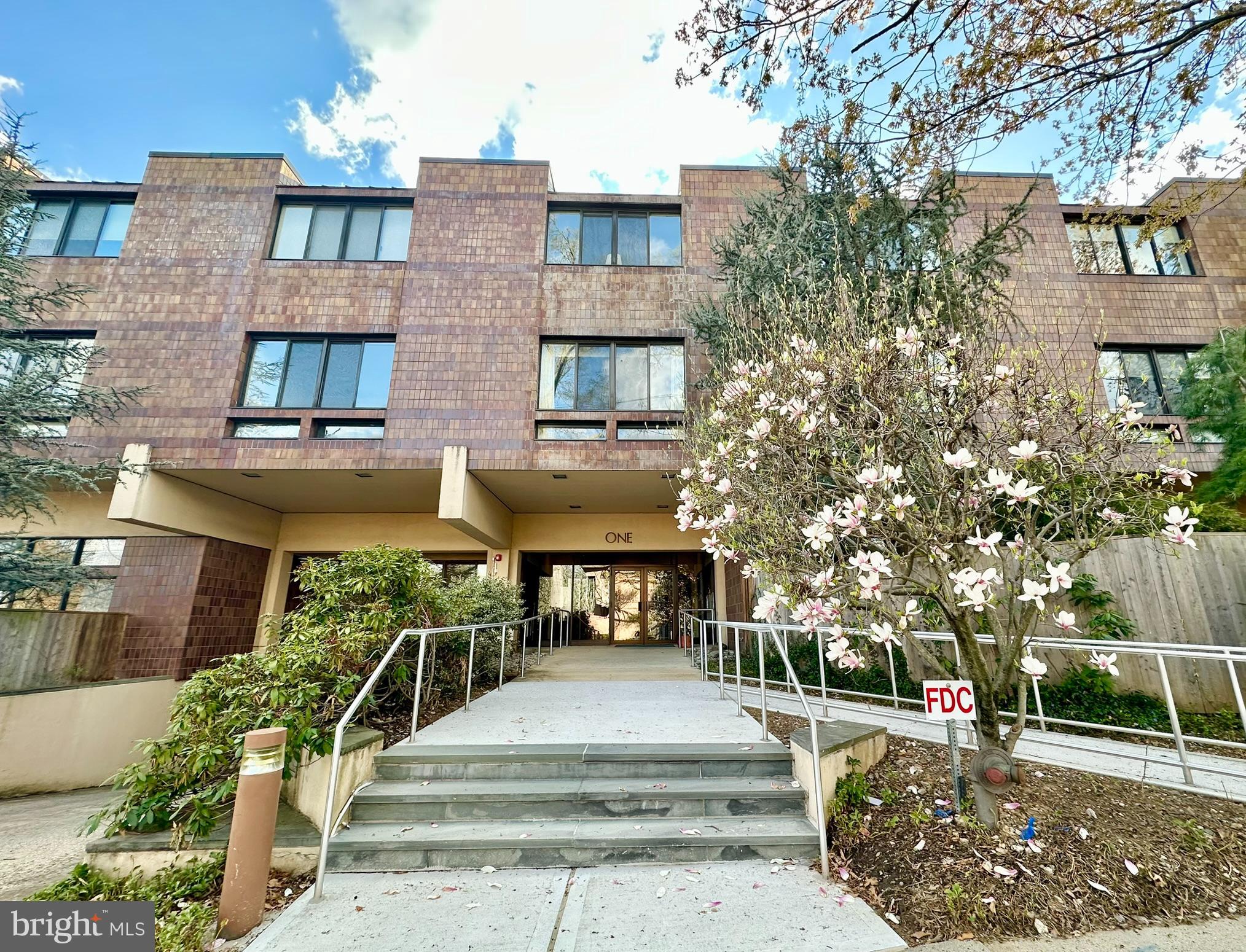 1 Markham Road, Unit 2E Princeton, NJ 08540 - Photo 2 of 30 a front view of a multi story building with yard