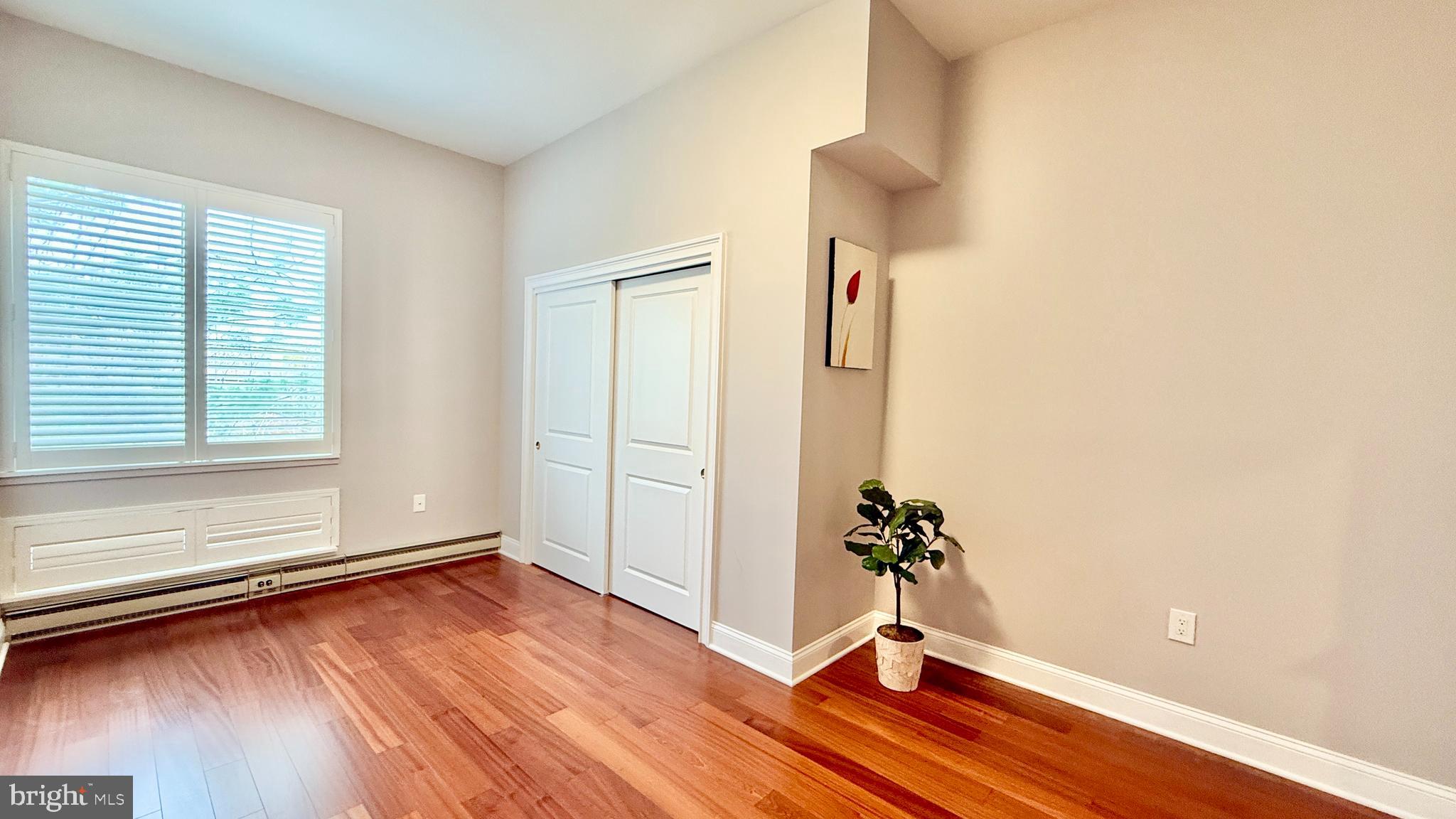 1 Markham Road, Unit 2E Princeton, NJ 08540 - Photo 22 of 30 an empty room with wooden floor and windows