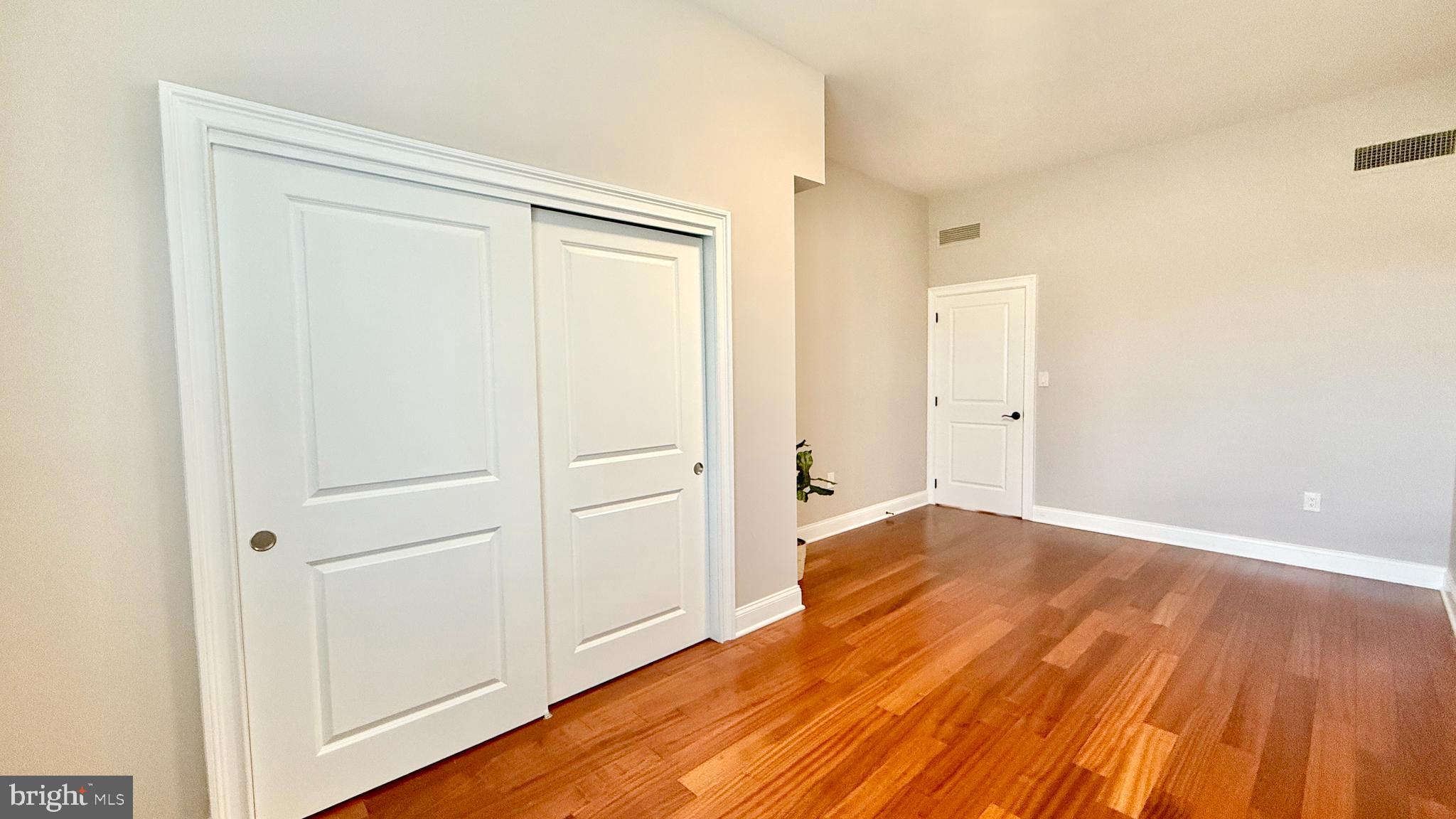 1 Markham Road, Unit 2E Princeton, NJ 08540 - Photo 23 of 30 wooden floor in an empty room