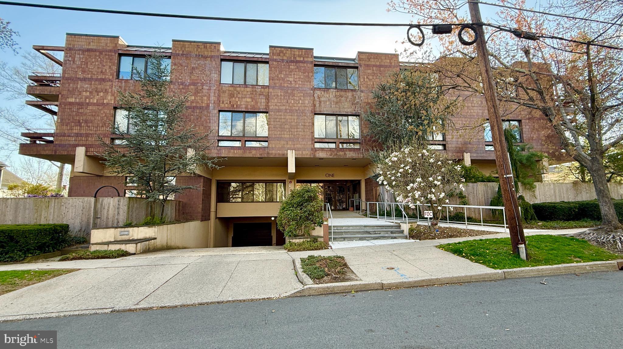 1 Markham Road, Unit 2E Princeton, NJ 08540 - Photo 29 of 30 a front view of a building with garden