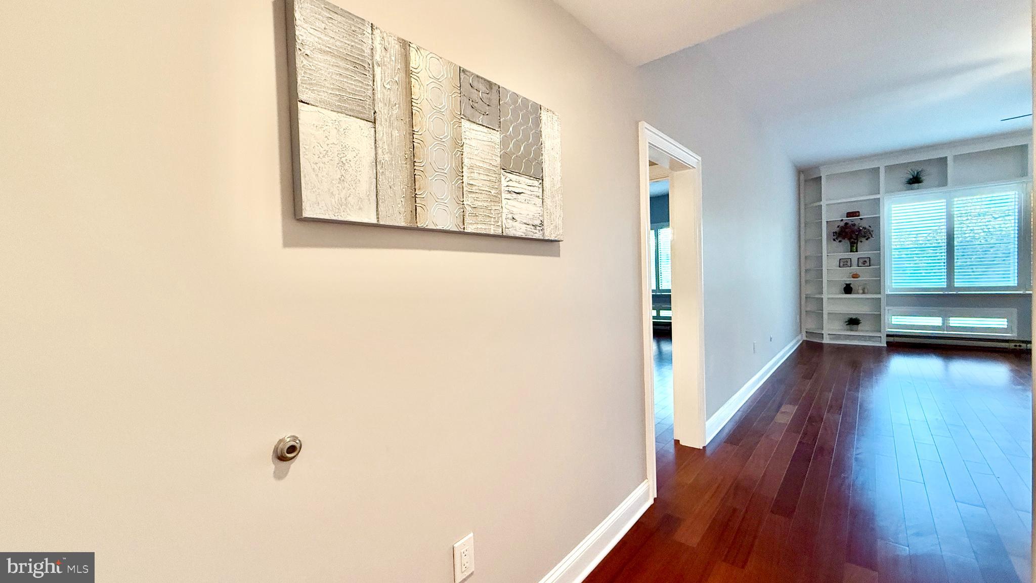 1 Markham Road, Unit 2E Princeton, NJ 08540 - Photo 3 of 30 a view of a hallway with wooden floor and stairs