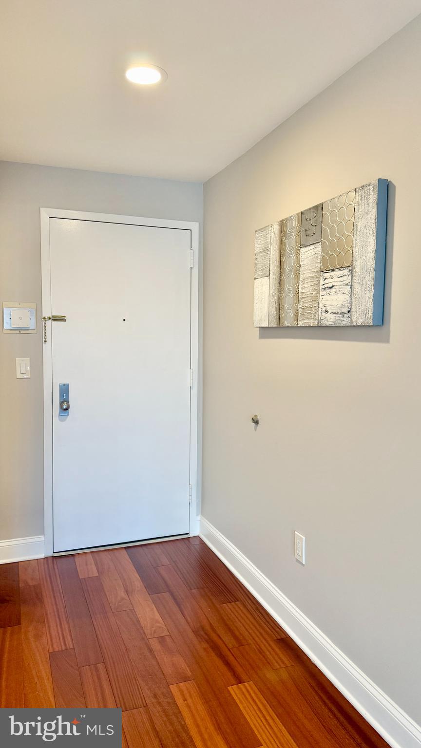 1 Markham Road, Unit 2E Princeton, NJ 08540 - Photo 4 of 30 a view of an empty room with wooden floor and a window