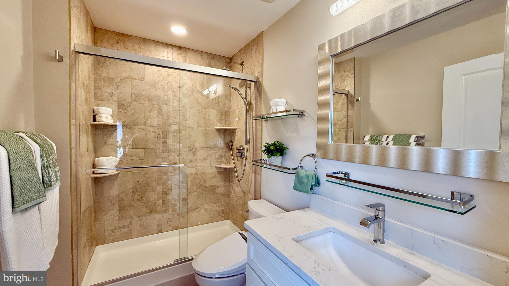 1 Markham Road, Unit 2E Princeton, NJ 08540 - Photo 9 of 30 a bathroom with a sink a toilet and shower
