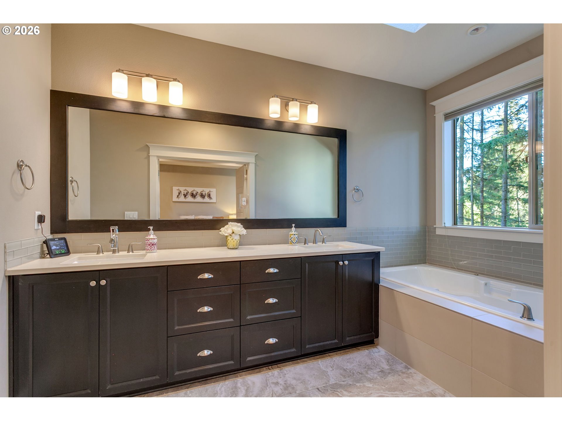 14390 Southwest Fox Lane Beaverton, OR 97008 - Photo 29 of 47 a bathroom with a tub sink and mirror