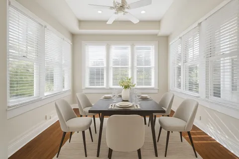 a view of a dining room with furniture window and wooden floor