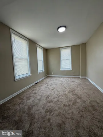 en empty room with windows