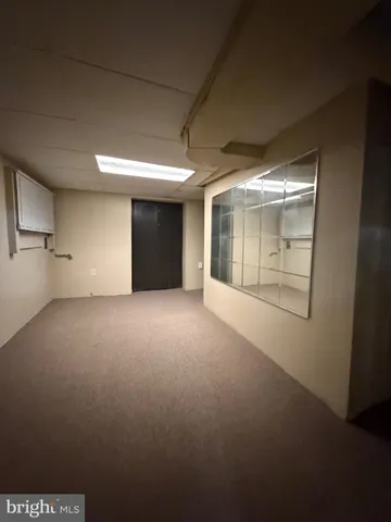 a view of empty room with windows