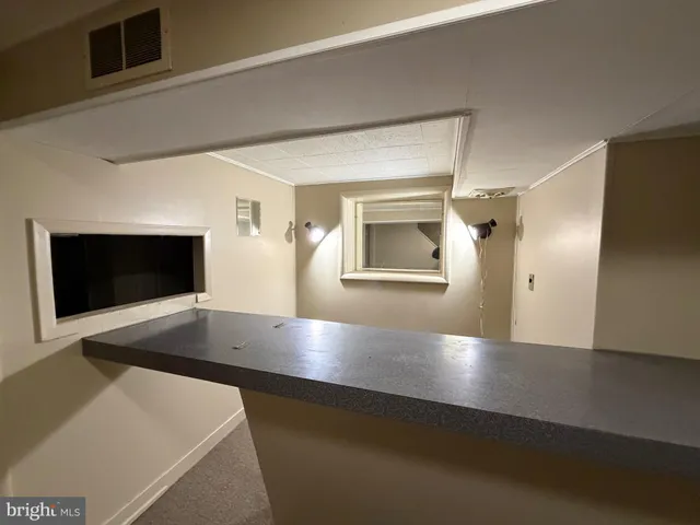 a view of a livingroom with a staircase