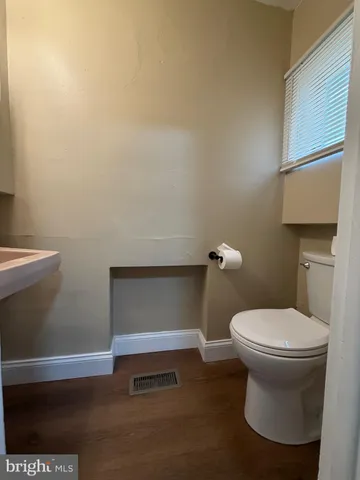 a bathroom with a toilet and a sink