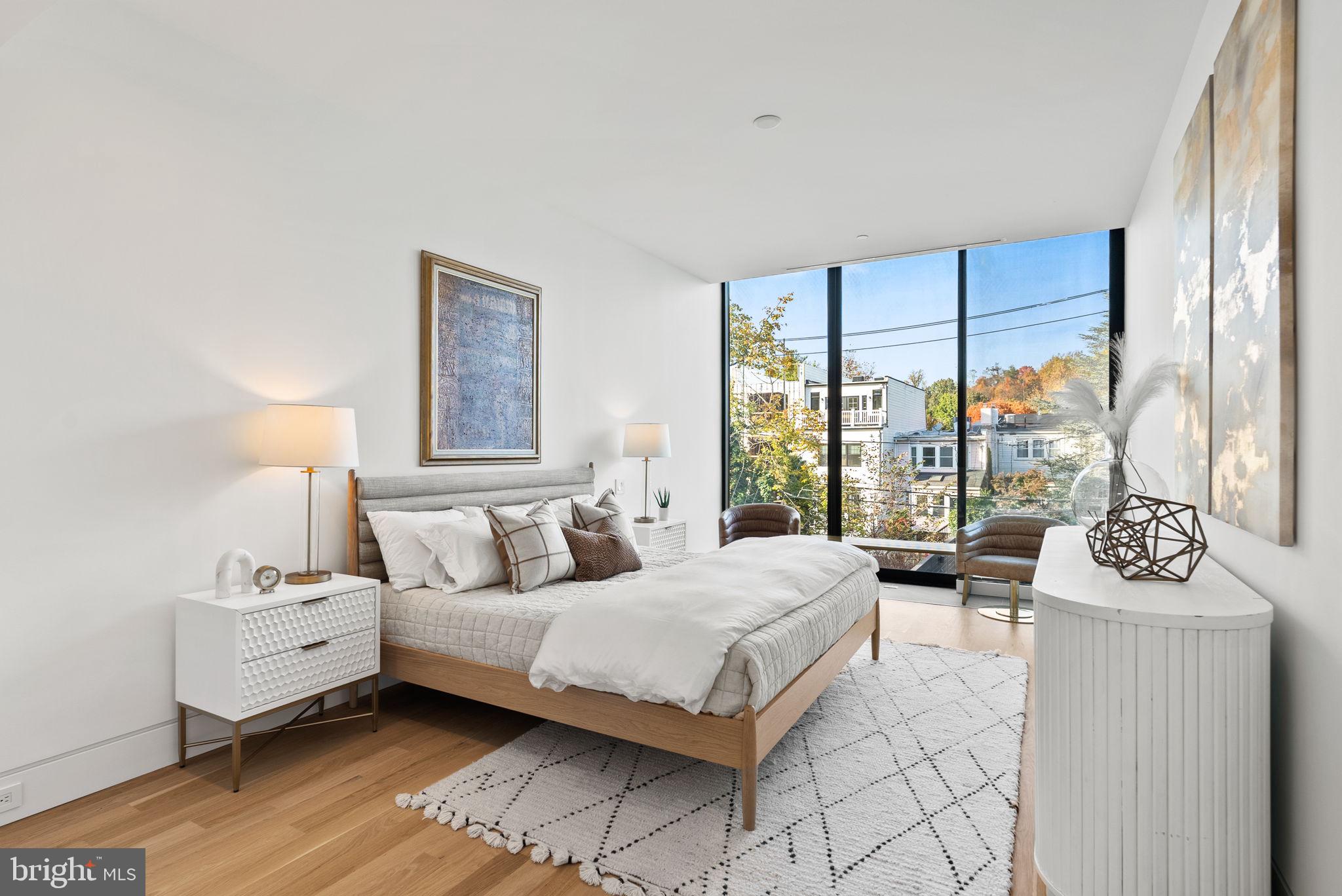 3623 R Street Northwest Washington, DC 20007 - Photo 18 of 87 a bedroom with a bed and large windows