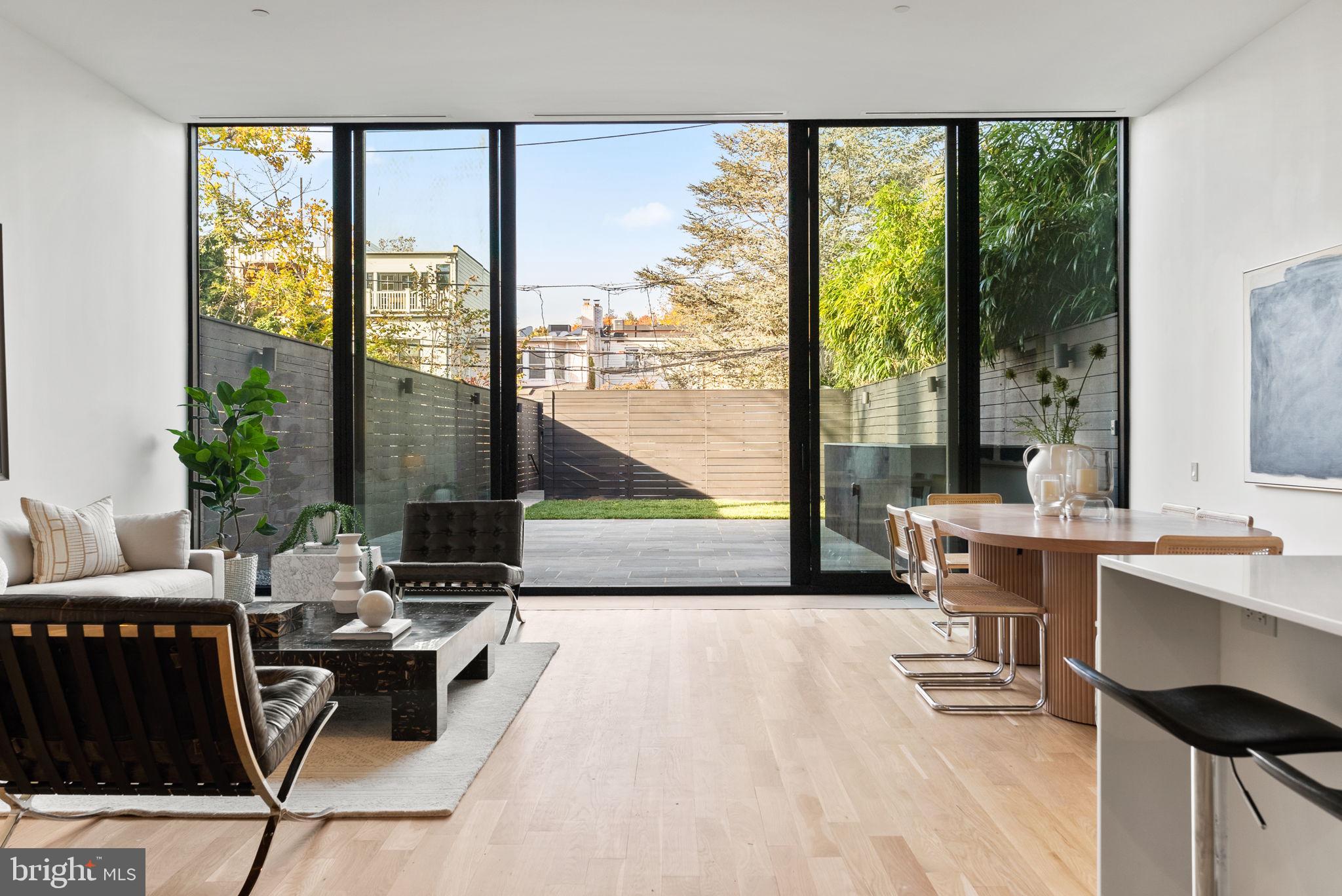 3623 R Street Northwest Washington, DC 20007 - Photo 4 of 87 a living room with a large window and a table