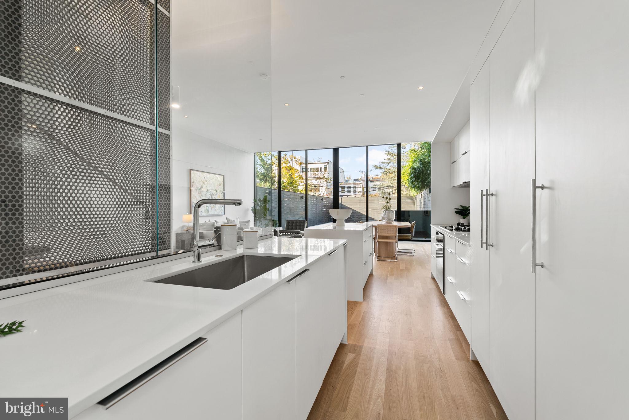 3623 R Street Northwest Washington, DC 20007 - Photo 42 of 87 a large white kitchen with a large window