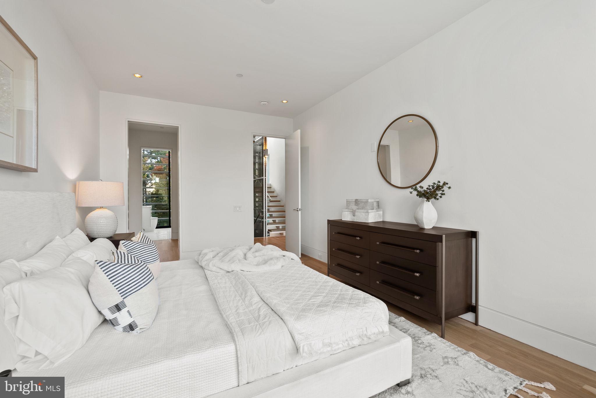 3623 R Street Northwest Washington, DC 20007 - Photo 44 of 87 a bedroom with a bed and a mirror