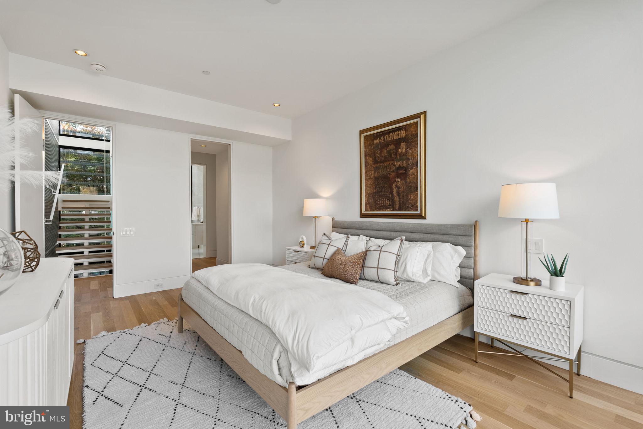3623 R Street Northwest Washington, DC 20007 - Photo 45 of 87 a bedroom with a bed and a lamp on table