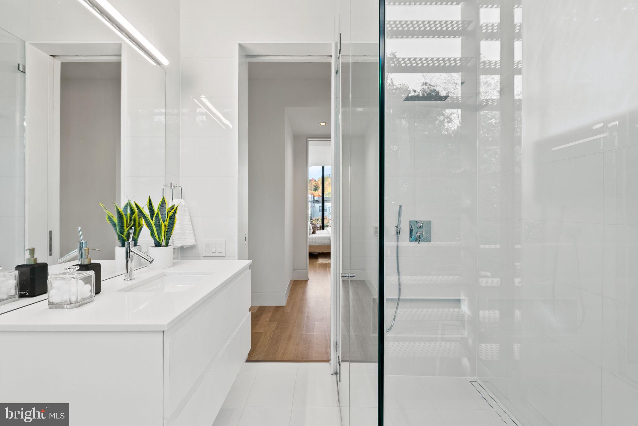 3623 R Street Northwest Washington, DC 20007 - Photo 46 of 87 a bathroom with a shower a sink and a mirror