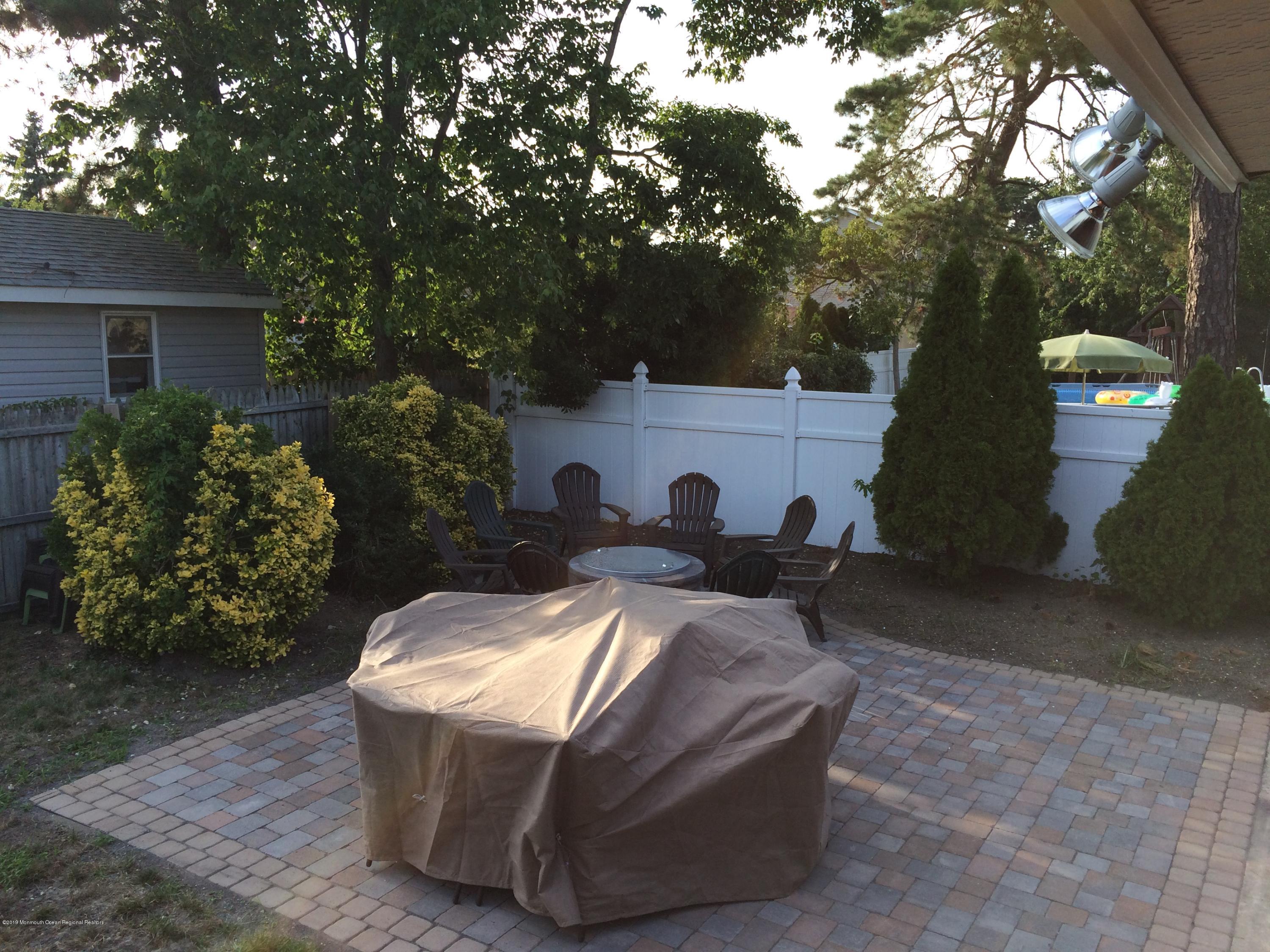 186 Binnacle Road Brick, NJ 08723 - Photo 21 of 25 a view of a white house and a yard with large tree