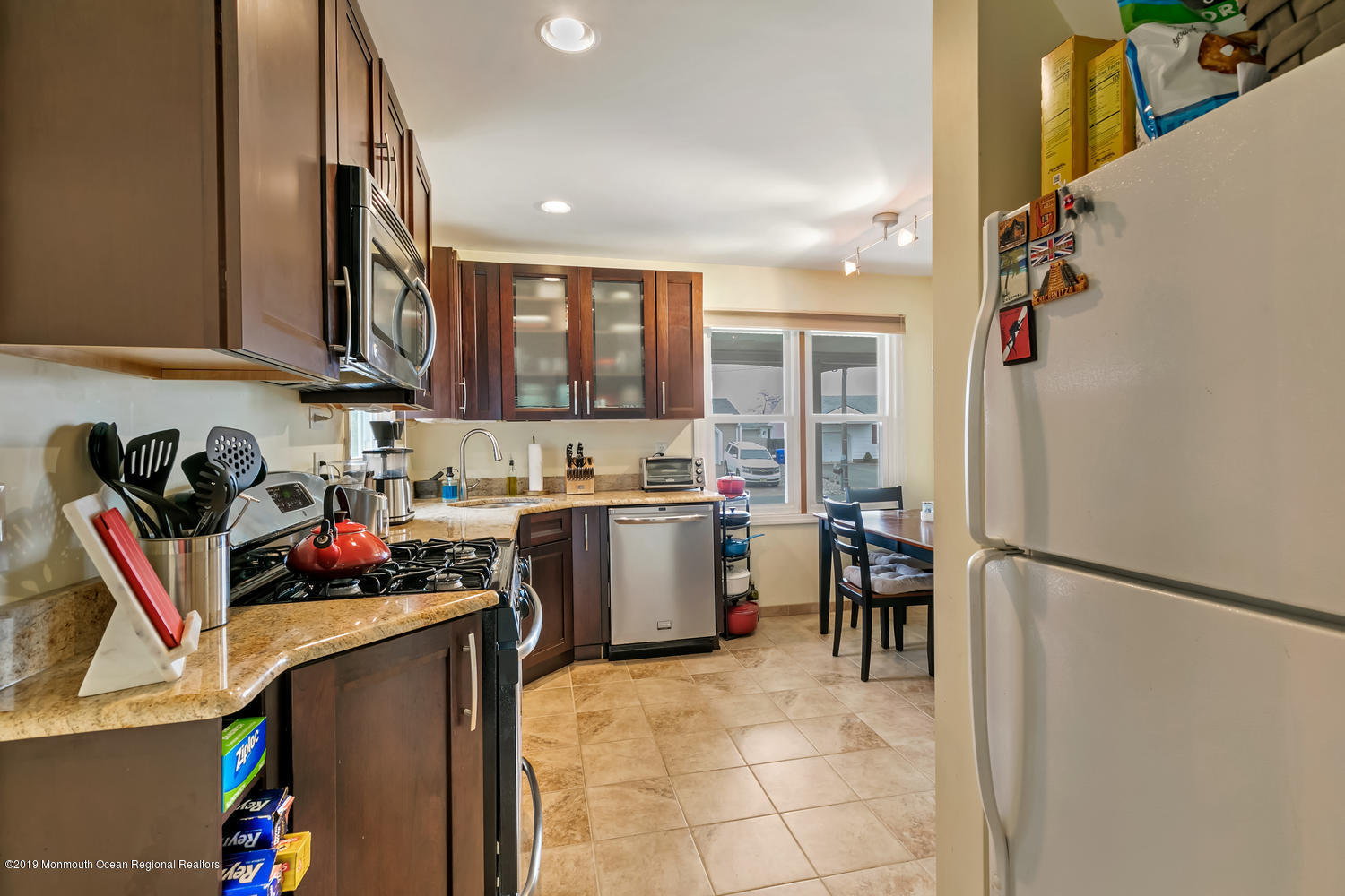 186 Binnacle Road Brick, NJ 08723 - Photo 8 of 25 a kitchen with stainless steel appliances granite countertop a refrigerator and a stove top oven