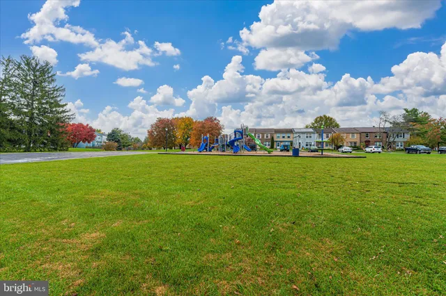 a view of yard with outdoor seating and green space