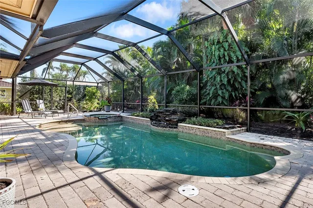 a view of a swimming pool with a patio