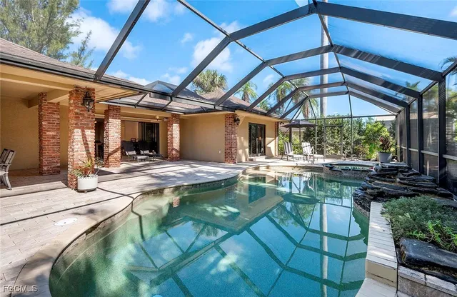 a view of a swimming pool with a patio