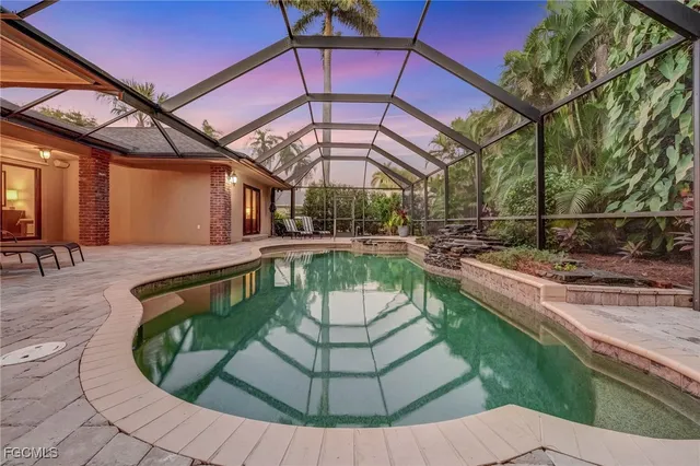 a view of a swimming pool with a patio