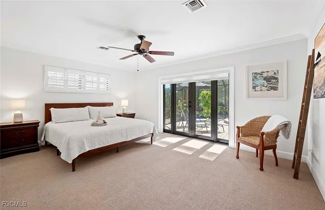 a spacious bedroom with a bed and a chair