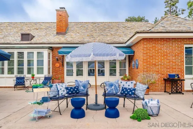 a view of a house with a garage and balcony