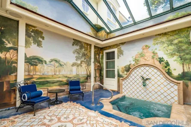 a bedroom with a bed and a potted plant