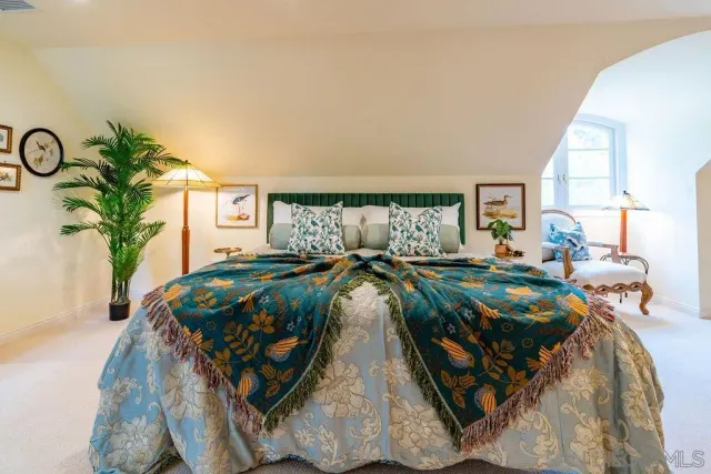 a view of a dining room with furniture large windows and wooden floor