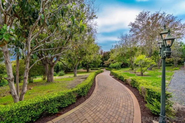 a view of a dining room with furniture chandelier and wooden floor